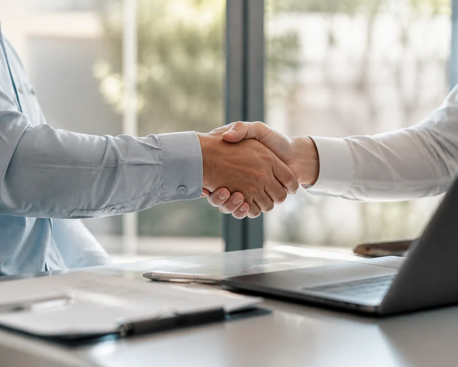 Two people shaking hands after agreeing a business arrangement