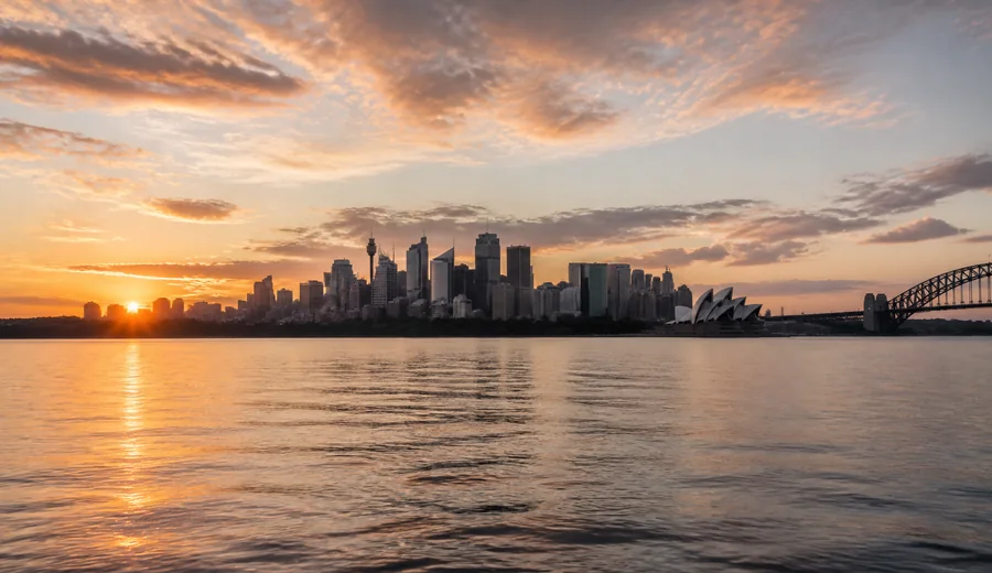 Sydney Opera House and harbour at sunset